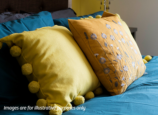 Photo of cushions on a bed