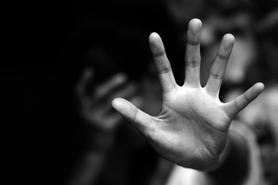 Black and white photo of a hand facing the camera