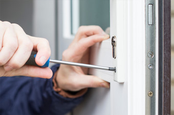 Photo showing someone working on a door