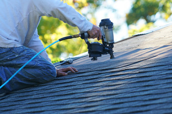 Photo of someone repairing a roof