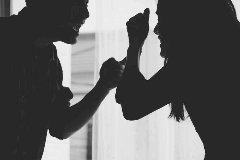 Black and white photo of two people arguing